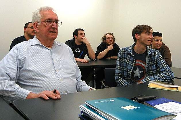 Walter Block ‘15 (CLAS), left, attends class at UConn Stamford on April 2, 2015. (Kim Krieger/UConn Photo)