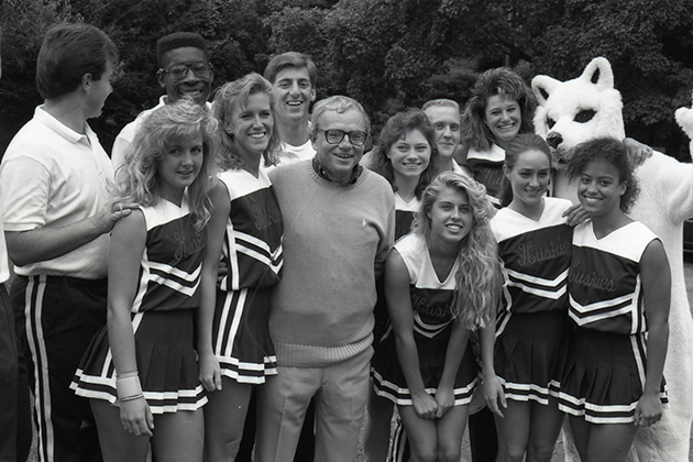 President Harry Hartley with cheerleaders at the President's picnic, in September 1990. (University of Connecticut Photograph Collection, Archives & Special Collections, UConn Libraries)