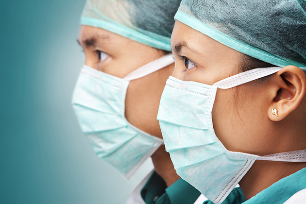 Two Asian physicians wearing protective masks. (iStock Photo)