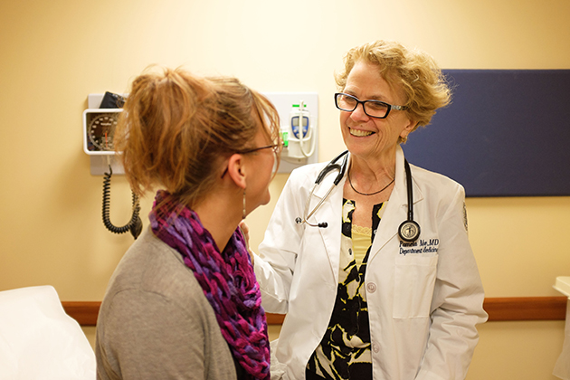 Dr. Pamela Moore, director of UConn Health Medical Services at Storrs Center, meets with a patient. (Peter Morenus/UConn Photo)