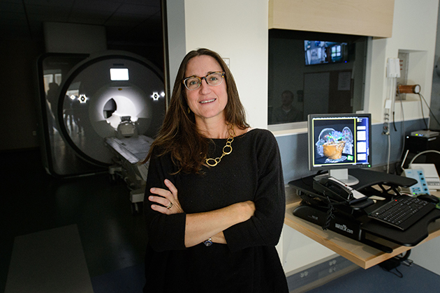 Inge-Marie Eigsti with the new FMRI at the Philips Communication Sciences Building on Sept. 28, 2015. (Peter Morenus/UConn Photo)