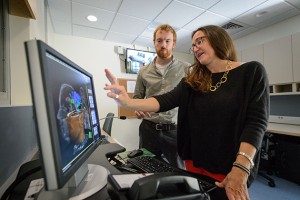 Inge-Marie Eigsti and John Green, a third year Ph. D. student, with the new FMRI at the Philips Communication Sciences Building on Sept. 28, 2015. (Peter Morenus/UConn Photo)