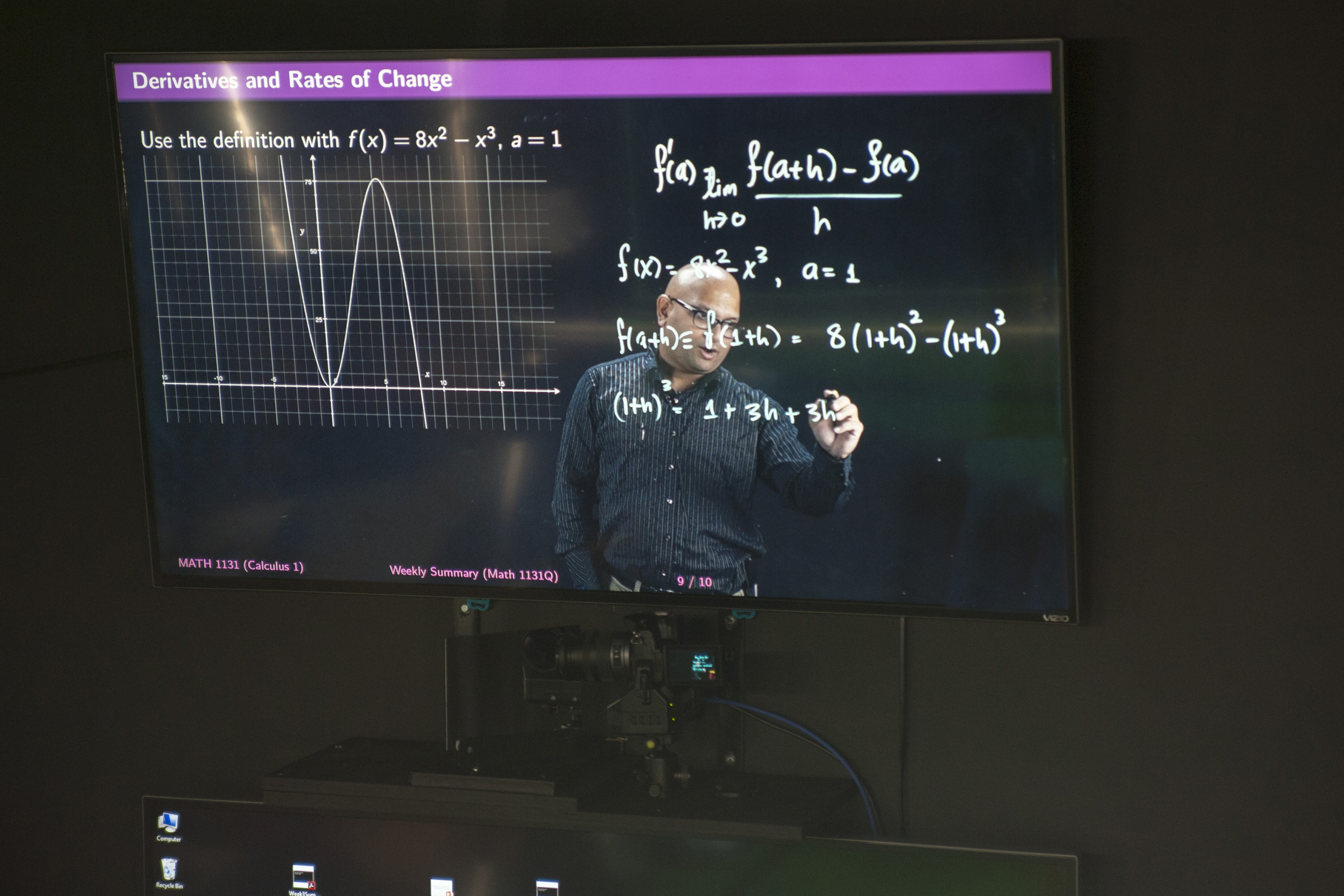 Amit Savkar, assistant professor-in-residence of math, tapes a lecture using Lightboard technology on Sept. 18, 2015. (Sean Flynn/UConn Photo)