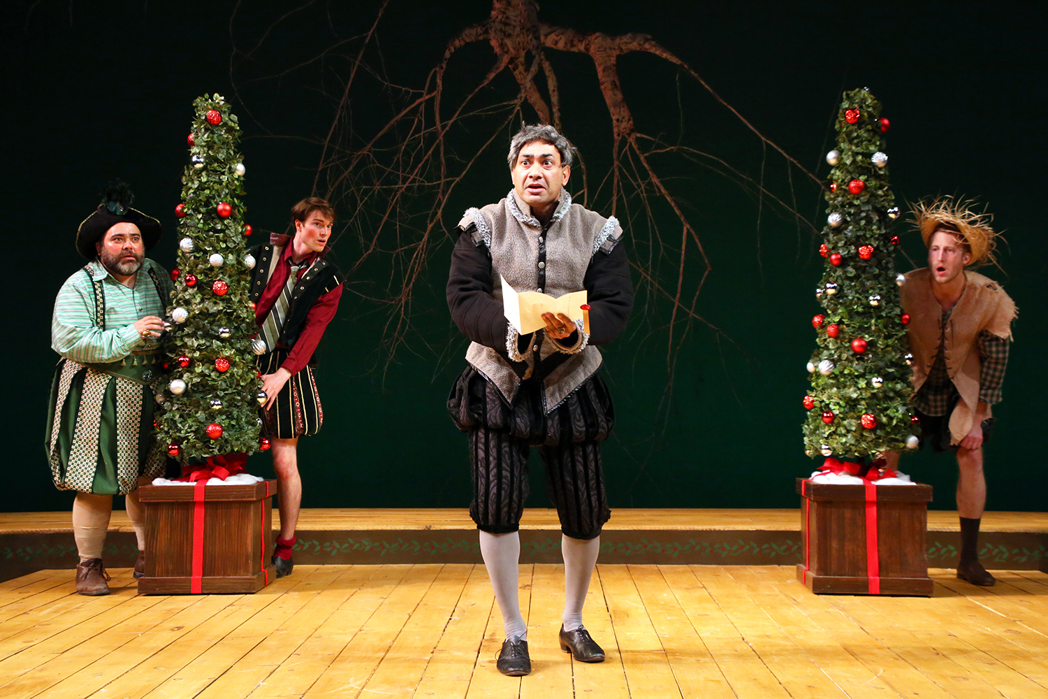Andrew Ramcharan Guilarte, center, as Malvolio, along with, from left, Richard Ruiz ’88 MFA, Mark Blashford MFA candidate in puppetry, ,and Curtis Longfellow, MFA candidate in acting, in Connecticut Repertory Theatre’s production of 'Twelfth Night,' by William Shakespeare. (Gerry Goodstein for UConn)