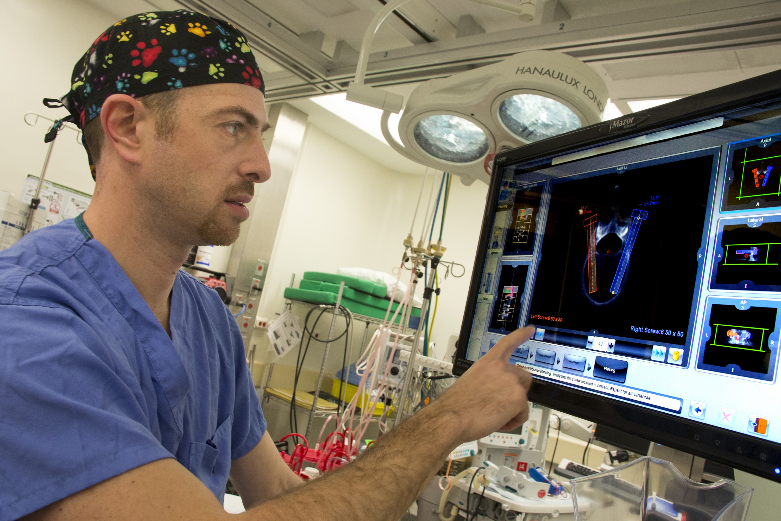 Dr. Isaac Moss of the UConn Musculoskeletal Institute will be New England’s and Connecticut’s first surgeon to use pioneering robotic guidance technology to assist him during spine surgery at UConn John Dempsey Hospital. (Janine Gelineau/UConn Health Photo)