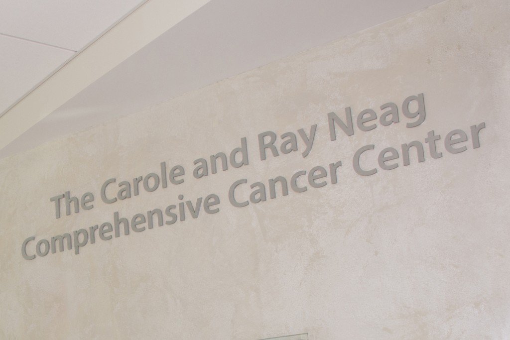 Sign at the entrance to the Carole and Ray Neag Cancer Center in the Outpatient Pavilion at UConn Health. (Janine Gelineau/UConn Health Photo)