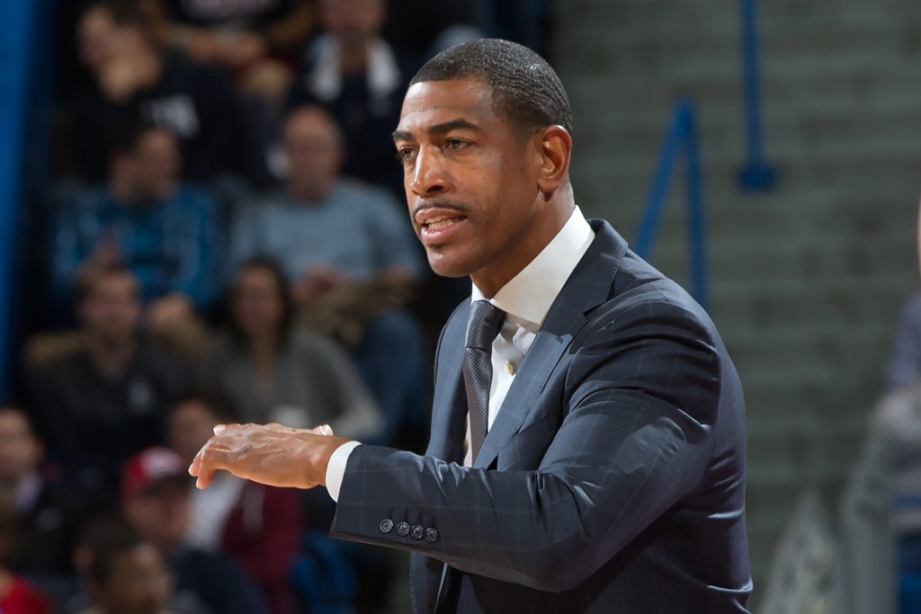 Men's basketball head coach Kevin Ollie coaches from the sidelines. (Stephen Slade '89 (SFA) for UConn)