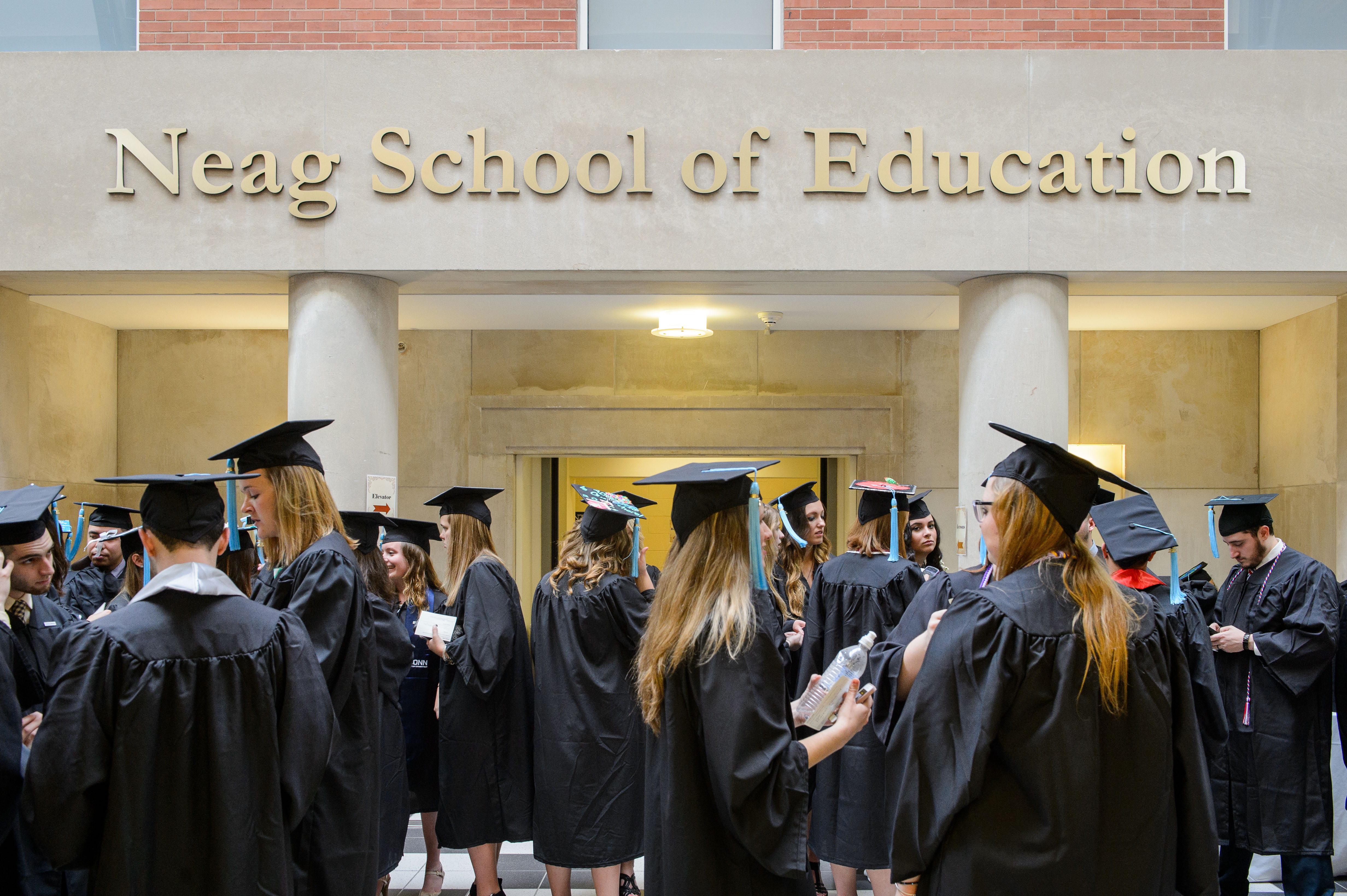 Neag School of Education degree candidates prepare for their Commencement procession at the Gentry Building on May 10, 2015. (Peter Morenus/UConn Photo)