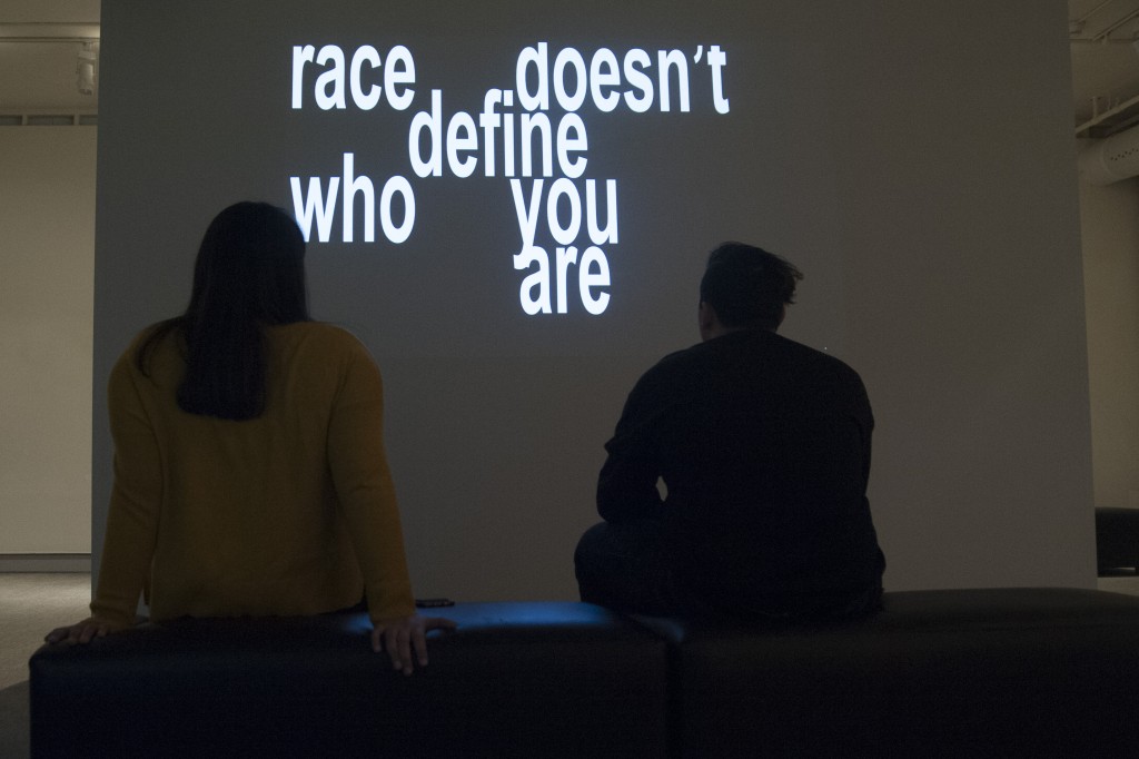 UConn Reads exhibit: works by graphic design students on the issue of race at the Benton on Jan. 22, 2016. (Sean Flynn/UConn Photo)