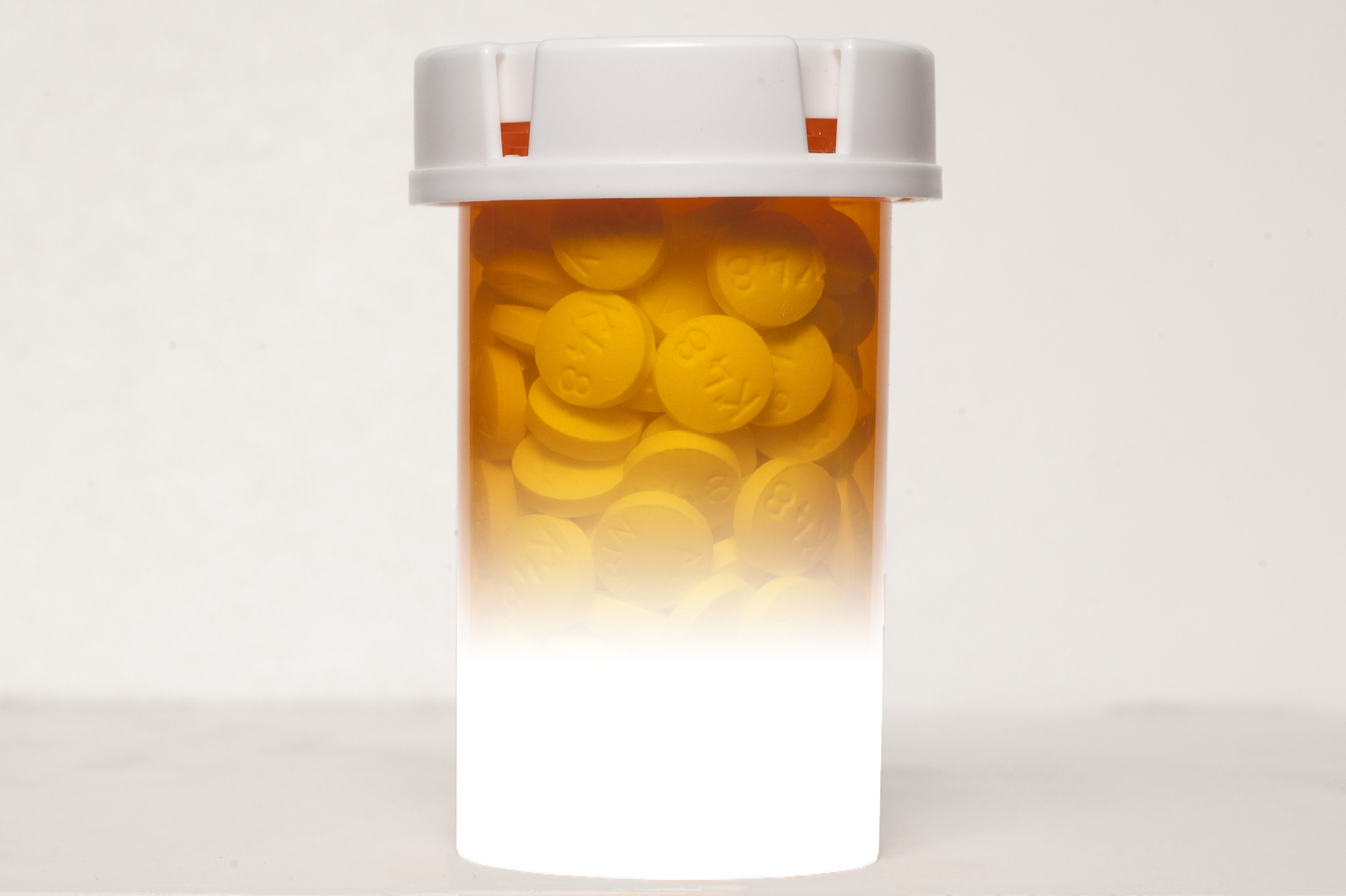 Still life photo of pills and pill bottles. (Sean Flynn/UConn Photo)
