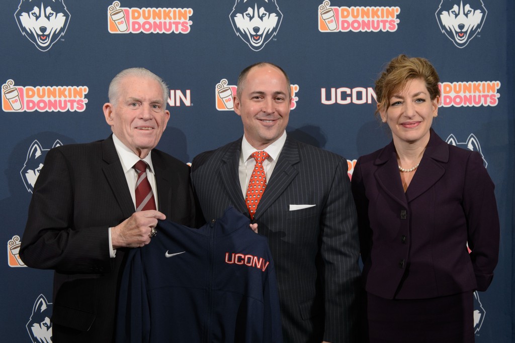 David Benedict, center, is introduced as the new Athletic Director by Board of Trustees Chairman Larry McHugh and University President Susan Herbst, at a press conference held at the Burton Family Football Complex today. (Peter Morenus/UConn Photo)