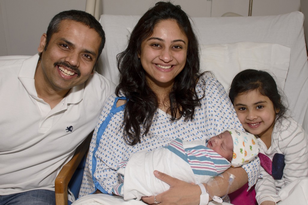 Leap Year baby Yuvraj Modi with his mom Shivu, dad Nish, and big sister Jahnvi at UConn John Dempsey Hospital. (Janine Gelineau/UConn Health Photo)