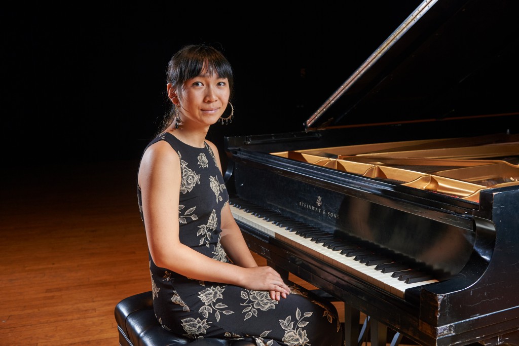 Calliope Wong poses for a portrait at the piano onstage at von der Mehden Recital Hall on Sept. 30, 2015. (Peter Morenus/UConn Photo)