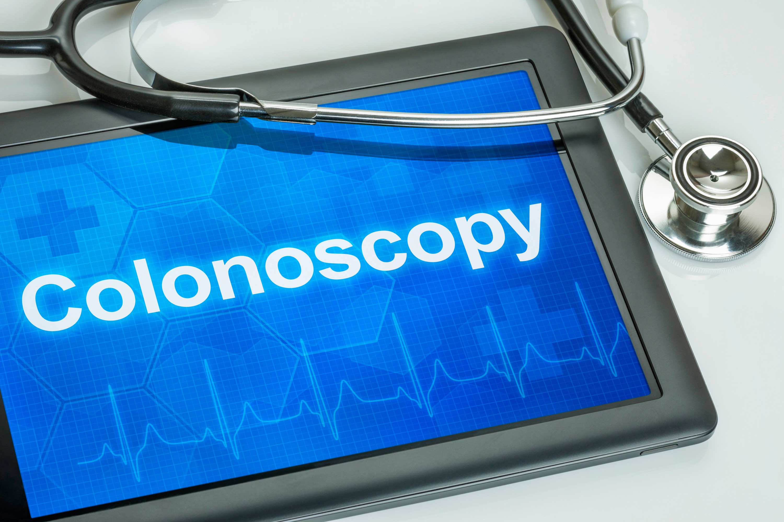 A tablet with the word colonoscopy, and a stethoscope. (Shutterstock Photo)