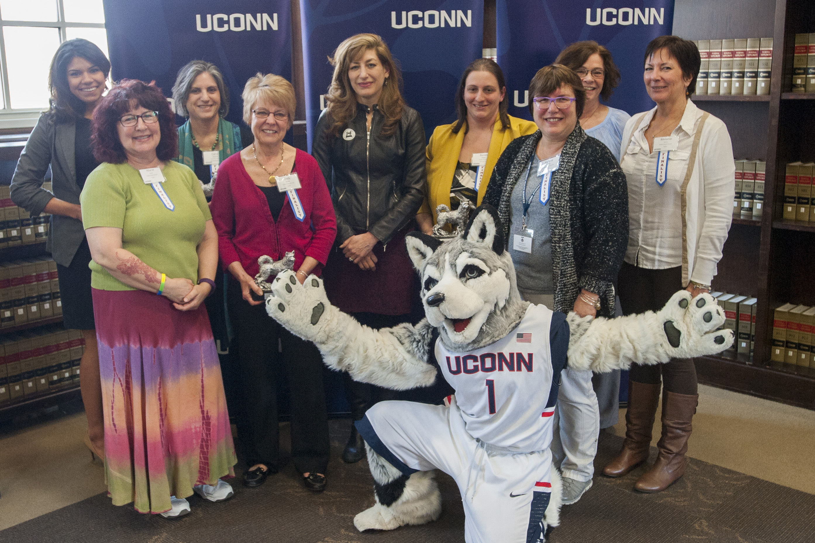 Back row from left, Aneesa Bey, Carol Millette, President Susan Herbst, Renee Boggis, Pat Moriarty, Melanie Kraus, front row, Hilarie Jones, Cindy Walsh, and Valerie Kiefer weree honored at the UConn Spirit Awards on March 8, 2016. (Sean Flynn/UConn Photo)
