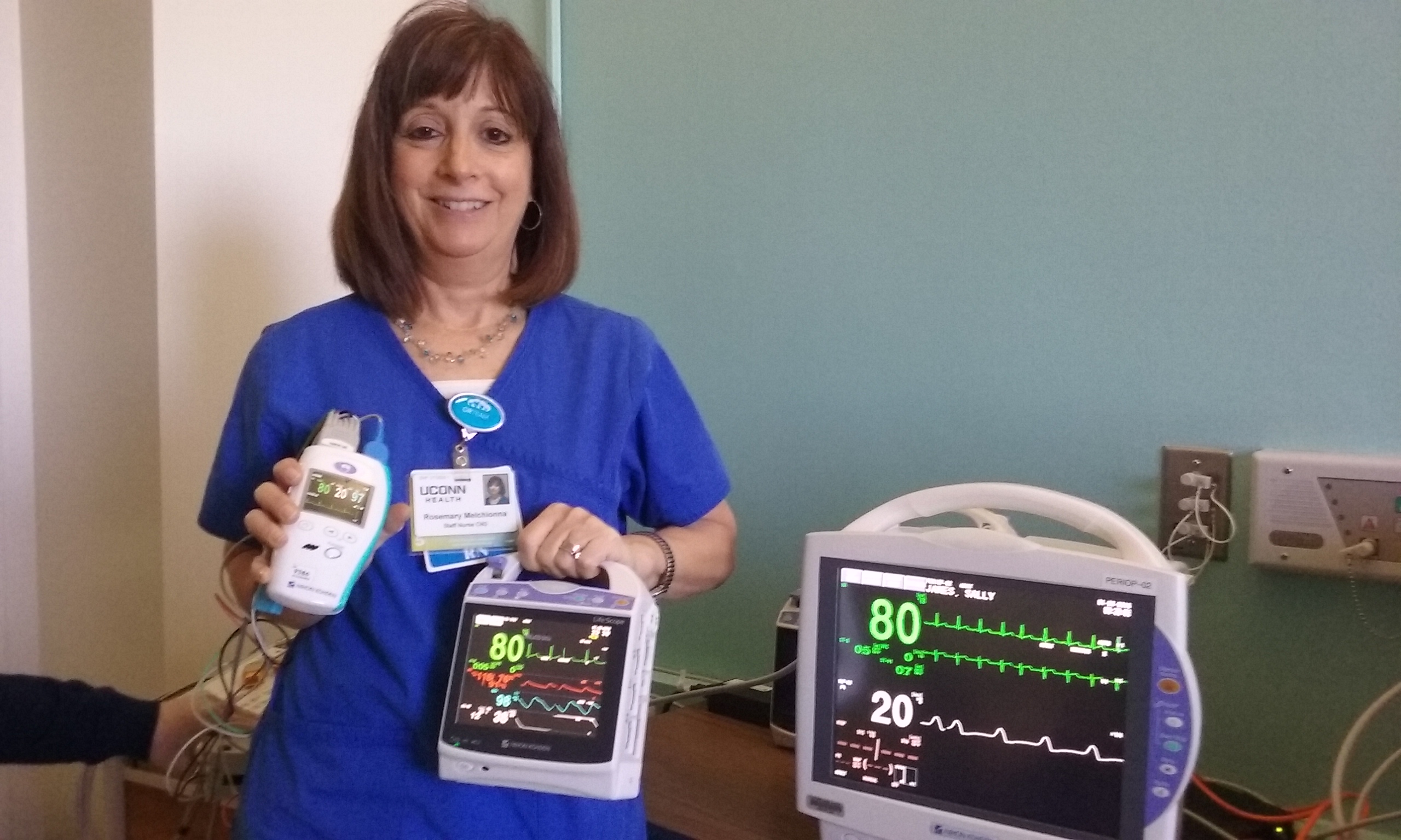 Rosemary Melchionna, a nurse in the post-anesthesia care unit, shows the updated central monitoring technology.