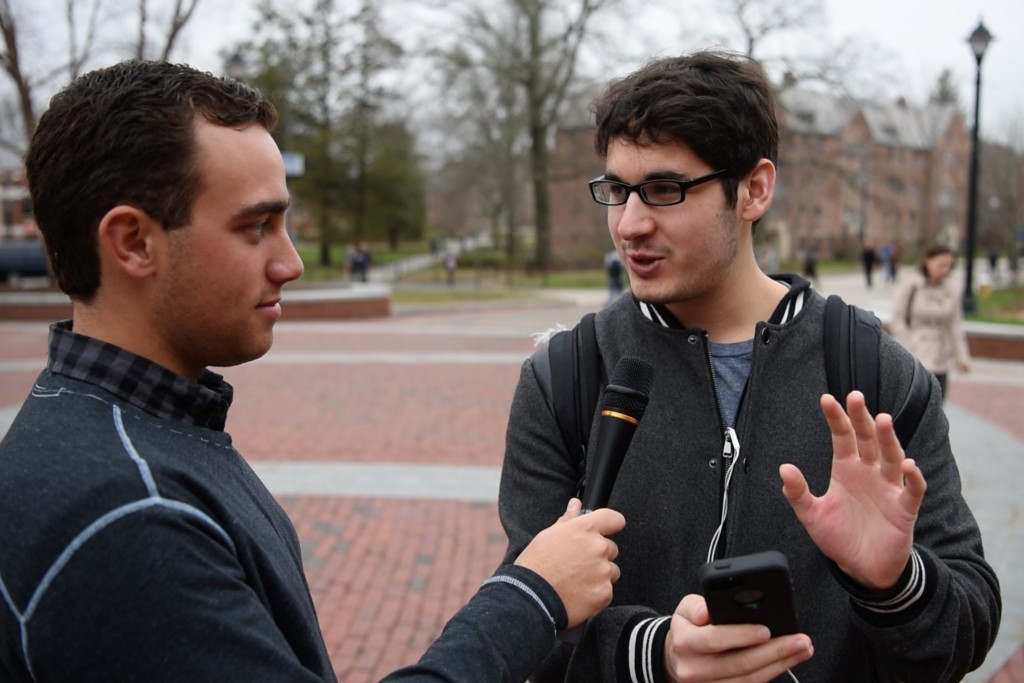 Ben Goldman ’18 (CLAS) interviews students on camera about the last photo on their phone. (Ryan Glista '16 (CLAS)/UConn Photo)