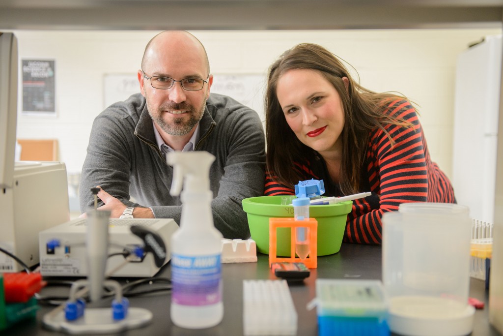 Kyle Baumbauer and Erin Young, at the Cell and Genome Sciences Building in Farmington on March 31, 2016. (Peter Morenus/UConn Photo)