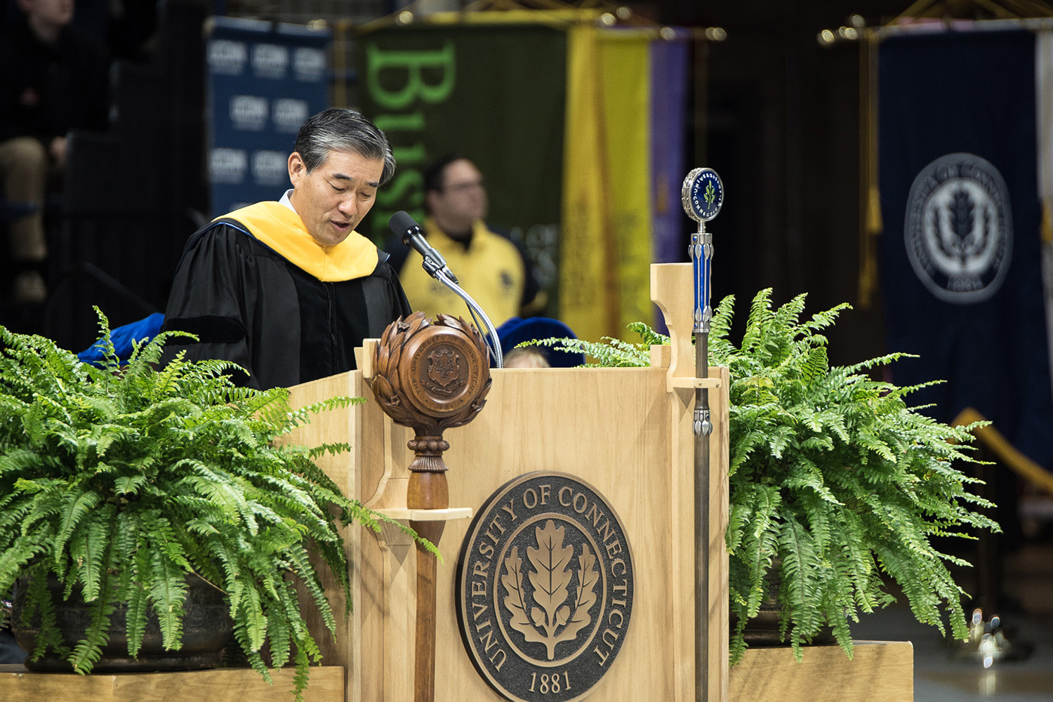 John Y. Kim '87 MBA, president and CIO of New York Life, offers advice to School of Business graduates during commencement on May 8. (Nathan Oldham/UConn photo)