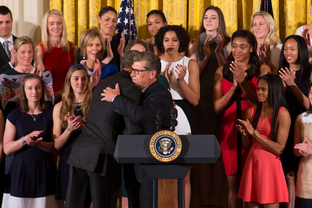 President Barack Obama and UConn Head Coach Geno Auriemma embrace at the White House on May 10, 2016. (Stephen Slade '89 (SFA) for UConn)