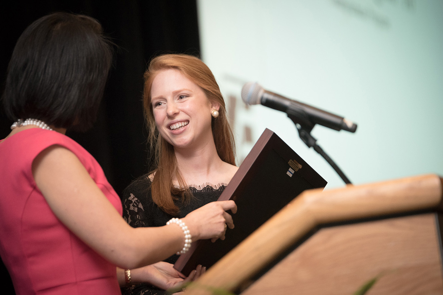 Associate Dean of Research Sulin Ba presents Emily Vasington '16 with her Hall of Fame award. (Nathan Oldham/UConn photo)
