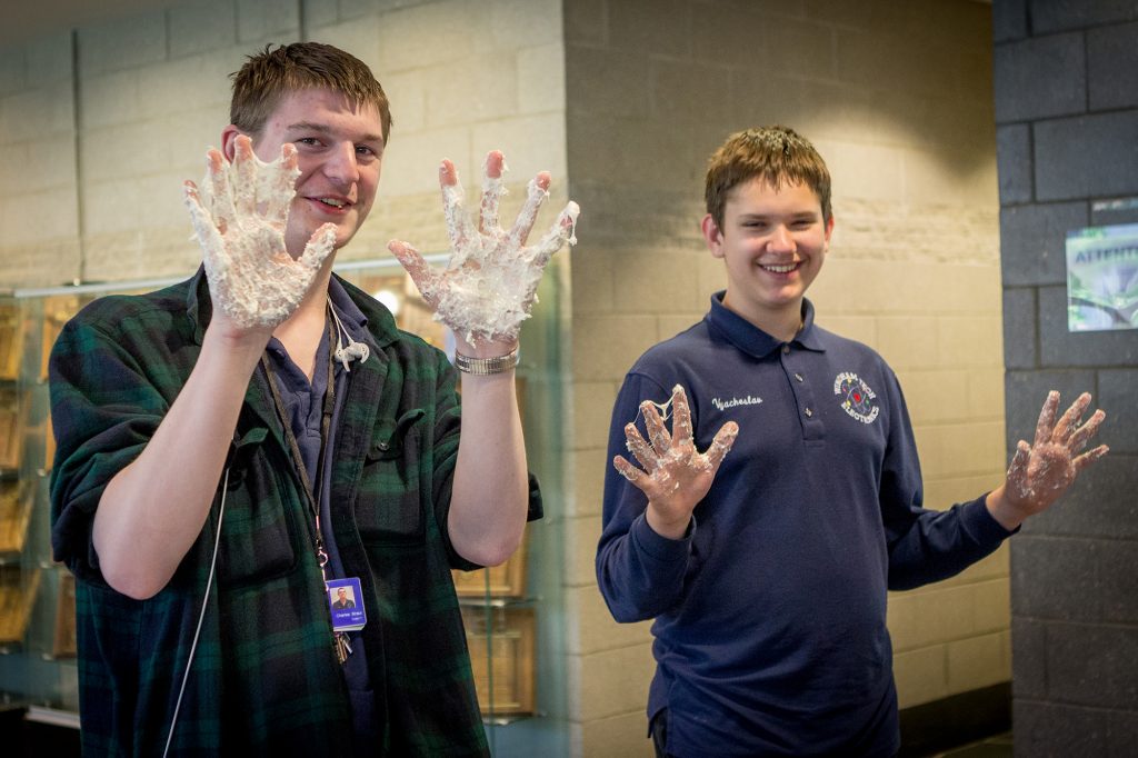 Windham High School Students display their marshmallow covered hands.