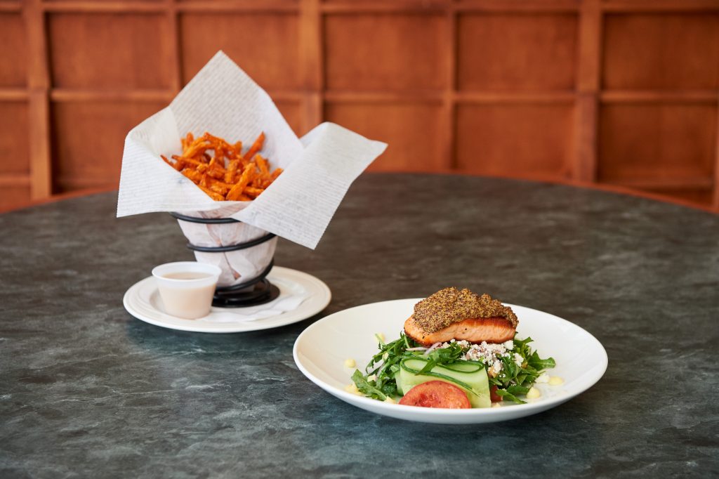 Sweet potato fries and Mediterranean salmon salad prepared at Chuck & Augies on March 24, 2016. (Peter Morenus/UConn Photo)