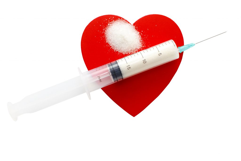 A syringe with sugar set on a heart, depicting diabetes and heart disease. (iStock Image)