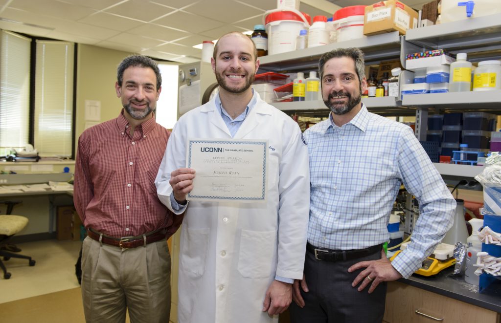 From left, Professor Adam Adler, Joseph Ryan, winner of the Lepow Award, and Immunology Dept. Chair Anthony Vella. (Photo by Janine Gelineau)