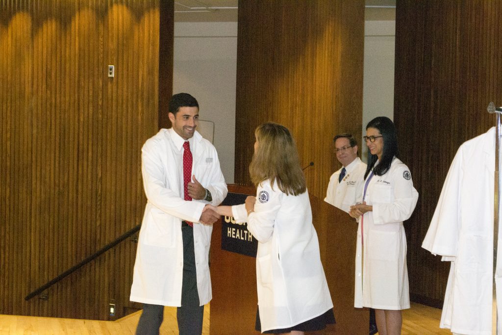 The UConn School of Dental Medicine class of 2020 received their white coats during a ceremony Aug. 19, 2016. (Photo by Kristin Wallace)