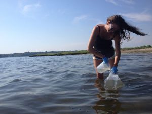 Emily Seelen taking water samples