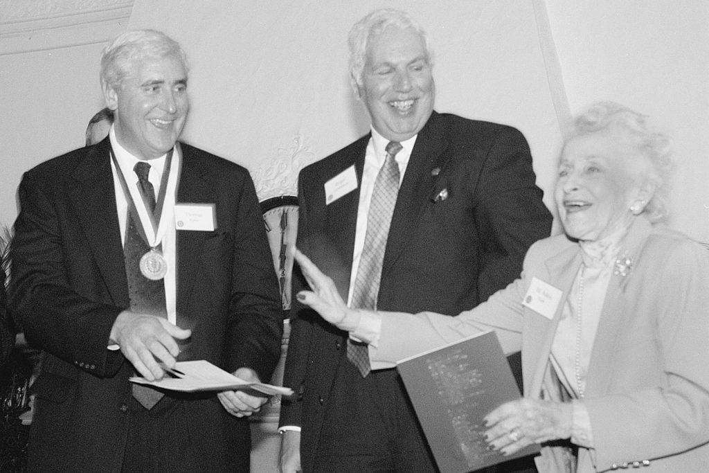 Thomas Ritter, recipient of UConn's highest honor, the University Medal, shares a joke with Roger A. Gelfenbien, chair of the Board of Trustees, and M. Adela Eads, Senate Minority Leader, at a reception at the School of Law in 1999. (Peter Morenus/UConn File Photo)