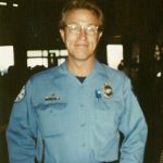 environmental portrait man in blue firefighter uniform
