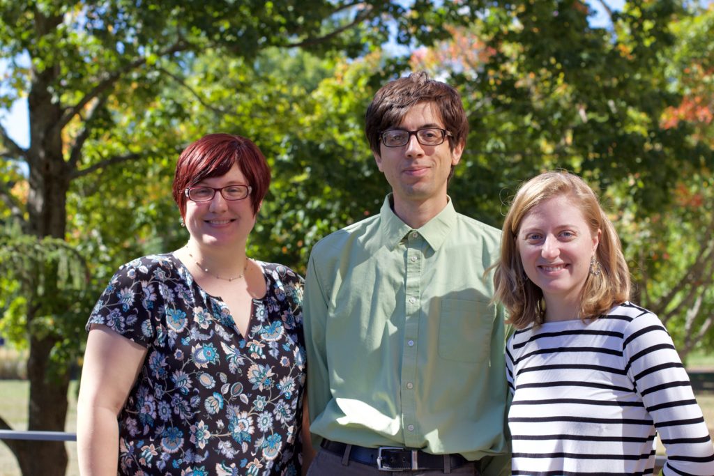 From left to right, English Ph.D. candidates Melissa Rohrer, George Moore, and Reme Bohlin. (Sydney Lauro/UConn Photo)