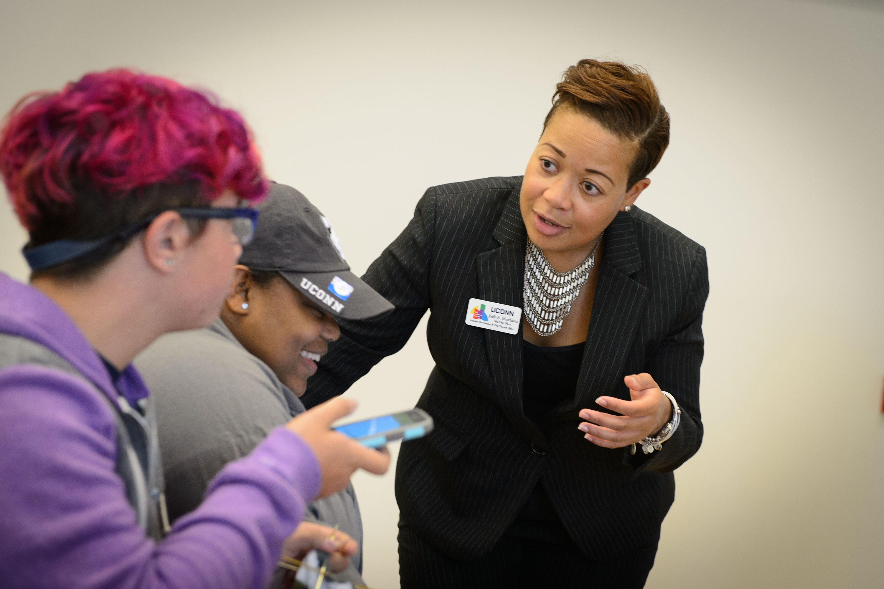 Associate vice president and chief diversity officer Joelle Murchison speaks with students before a forum on the recent violence seen in Orlando held at the Student Union Ballroom on Oct. 4, 2016. (Peter Morenus/UConn Photo)