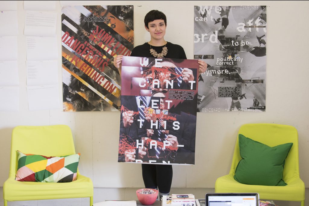 IDEA Grant recipient Raeanne Nuzzo displays poster designs that incorporate images and language from this year's Presidential election campaign. (Sean Flynn/UConn Photo)
