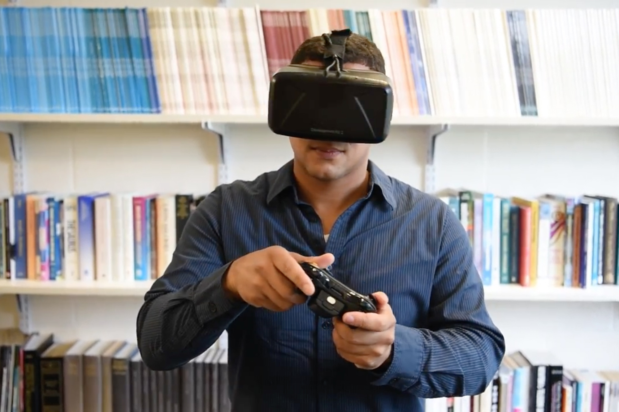 Assistant professor of communication John Christensen wearing a virtual reality headset. (UConn Photo)