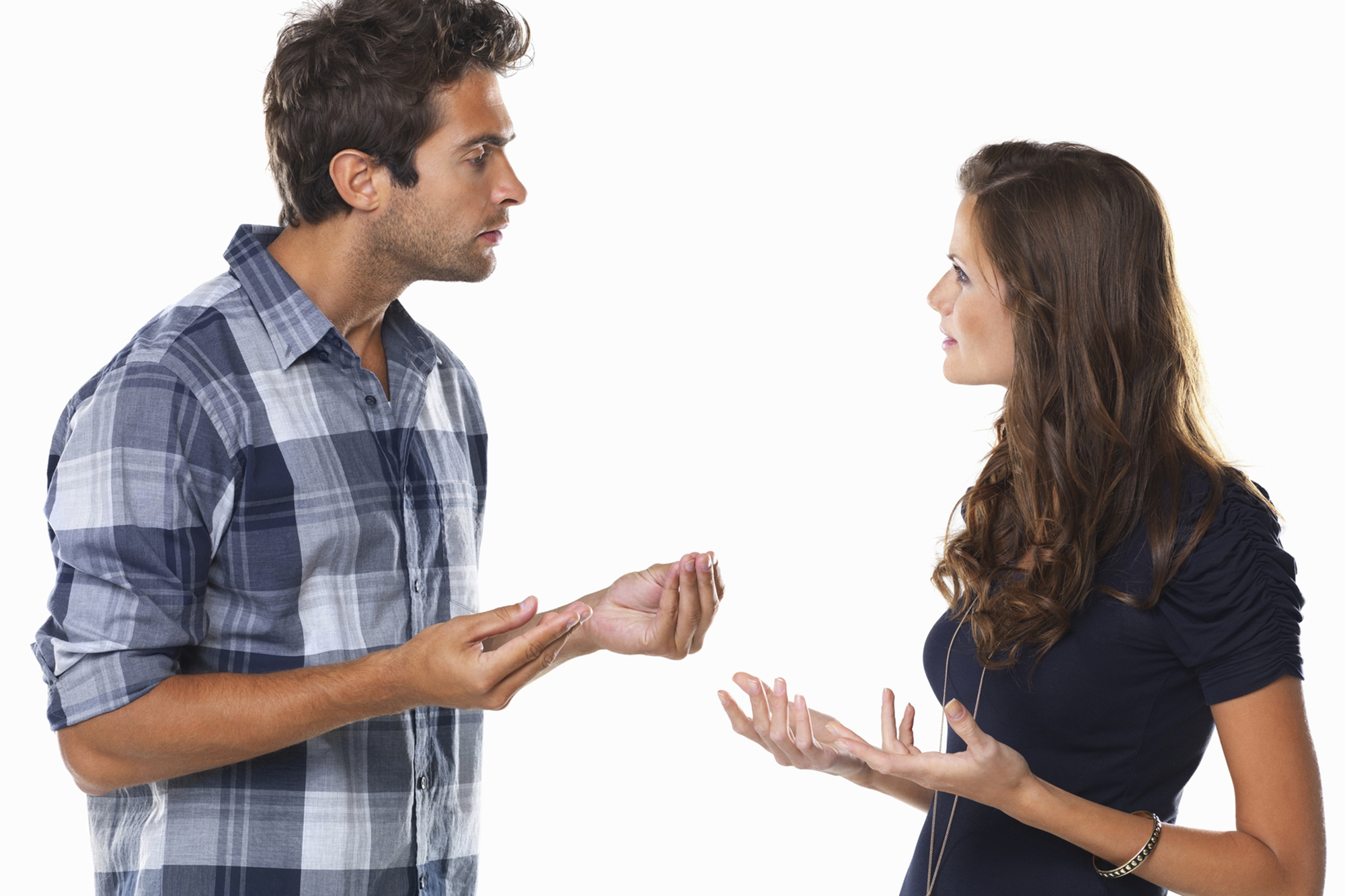 Couple engaged in a heated discussion. (momentimages/Getty Images)