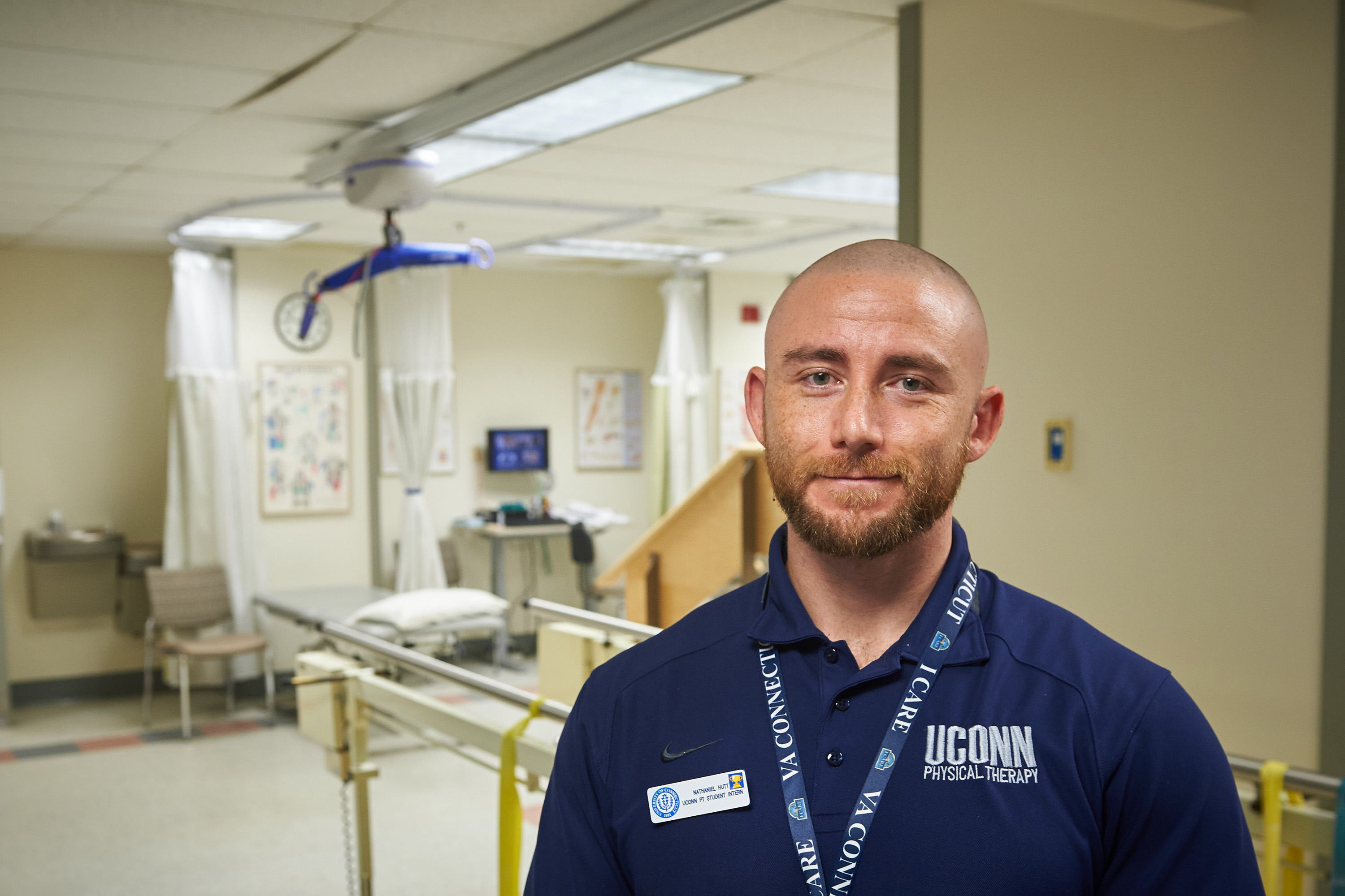 Nathaniel Hutt, a doctoral student of kinesiology, at the Outpatient Rehab Clinic at the VA Hospital in West Haven on Nov. 9, 2016. (Peter Morenus/UConn Photo)