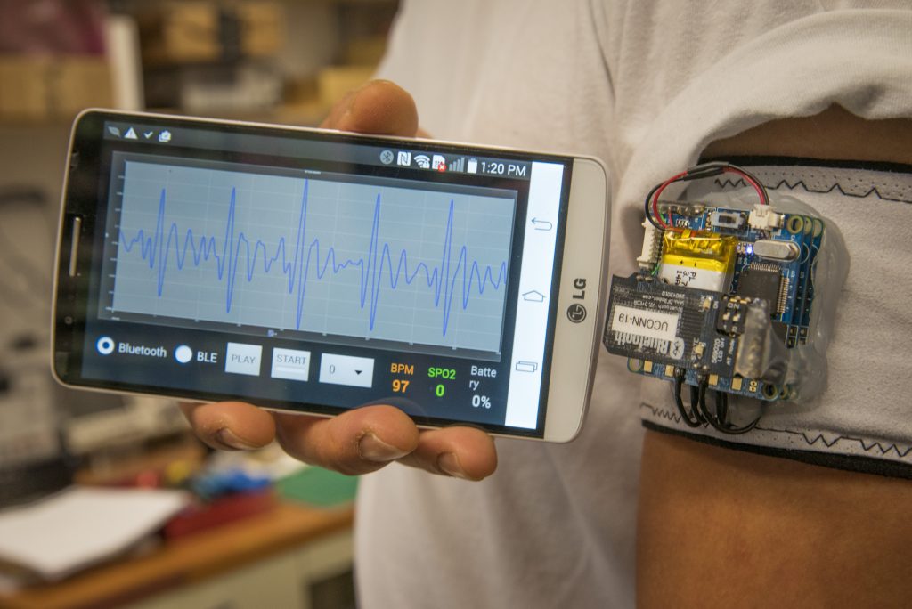 A heart monitoring device that detects irregular heart beat algorithms, using sensors attached to an armband and a phone app. (Sean Flynn/UConn Photo)