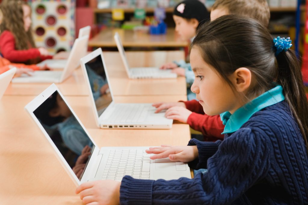 School children using computers. (Tetra Images – Erik Isakson/Getty Images)