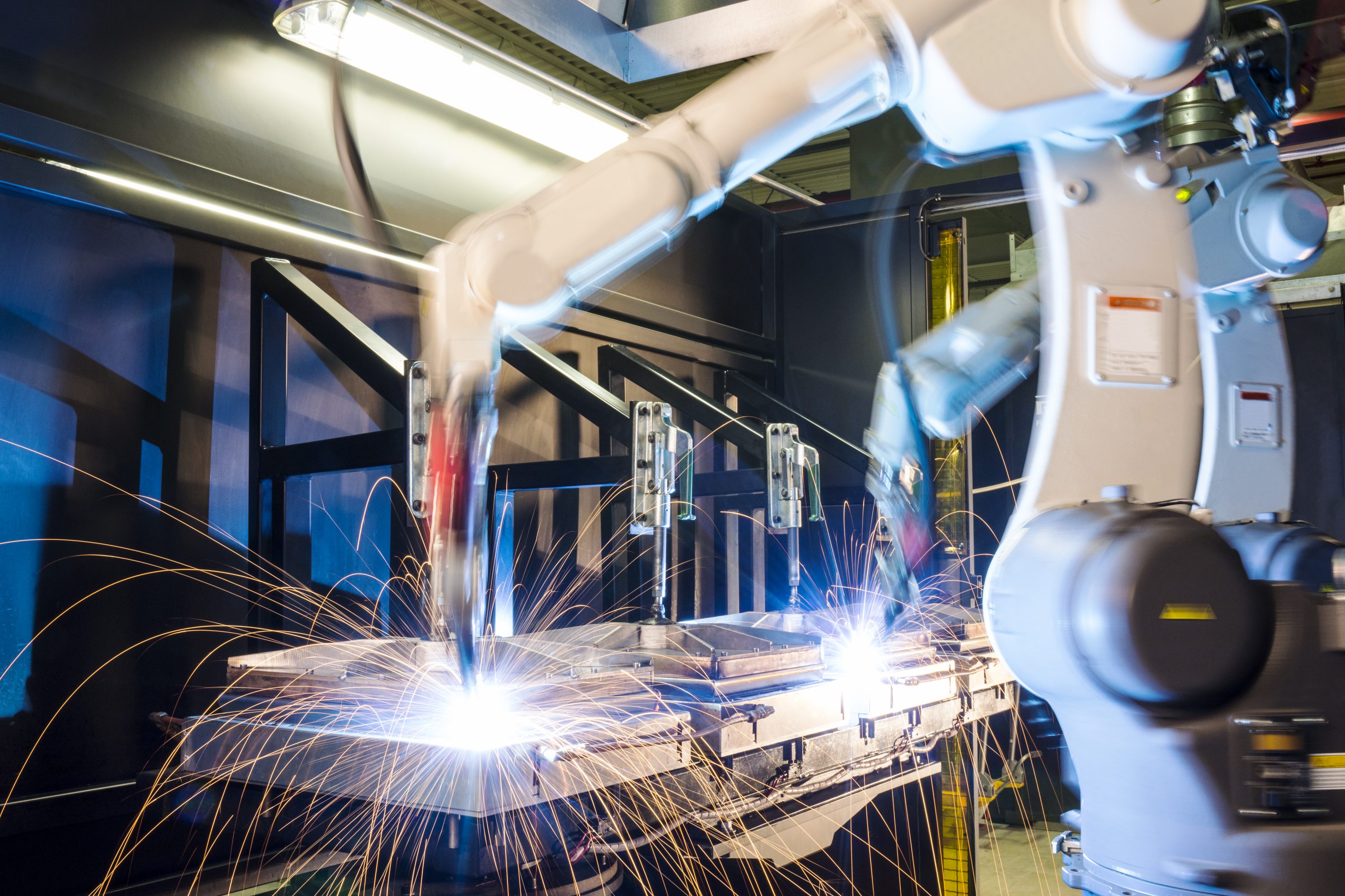 High-tech, industrial robotic welding machines in operation. (Getty Images)