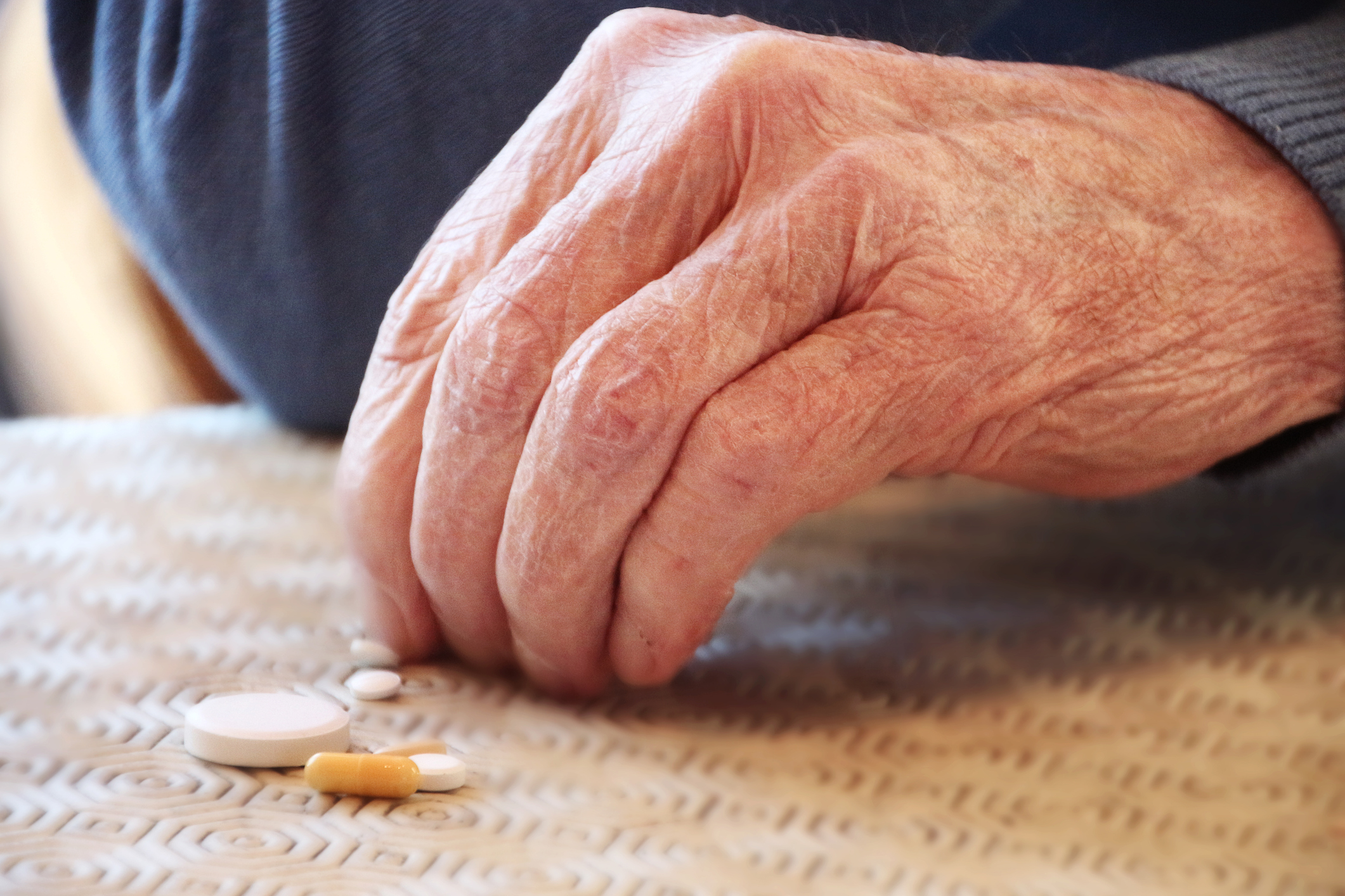 An elderly man taking his pills. (Getty Images)