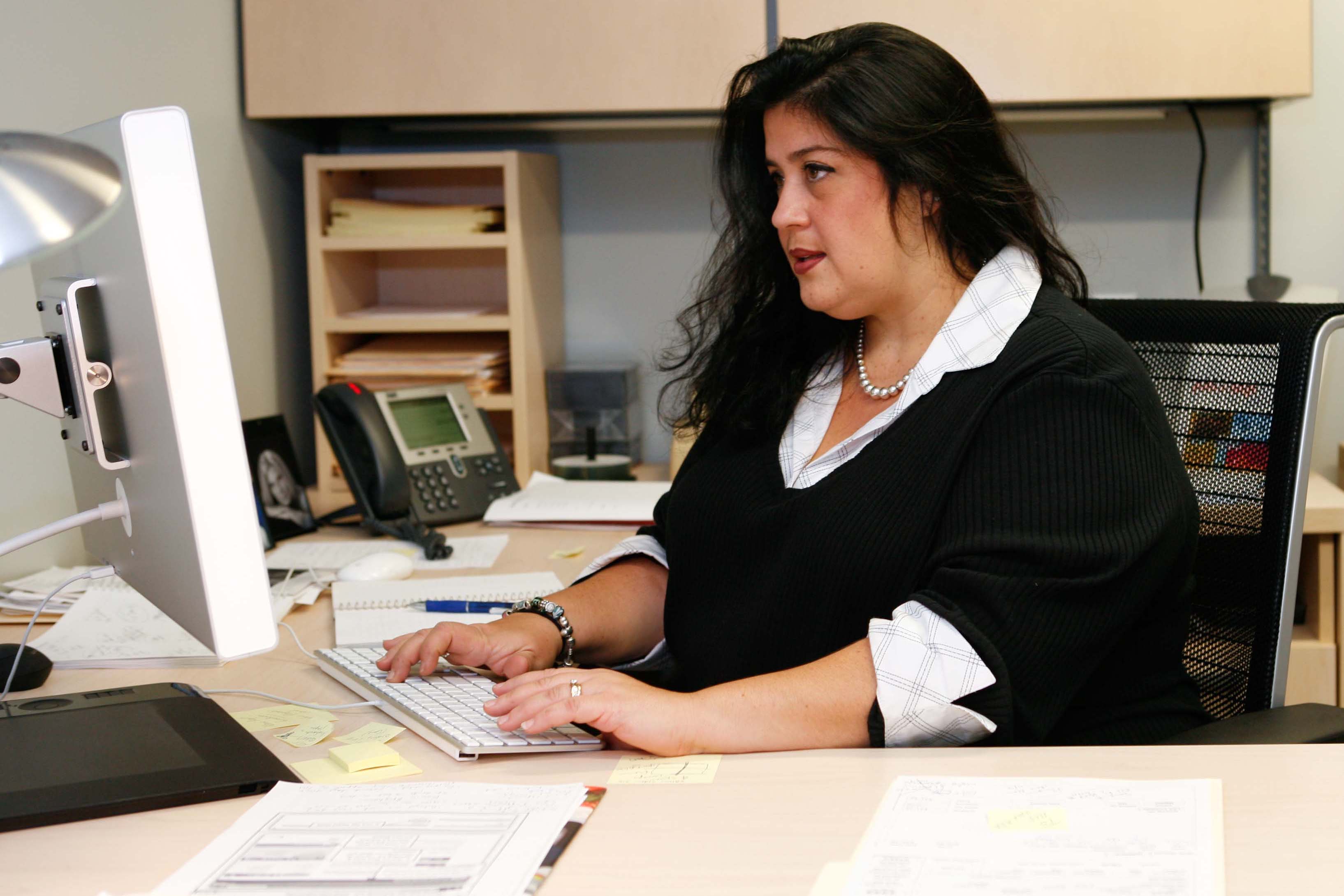 An overweight woman in an office. (Rudd Center Photo)
