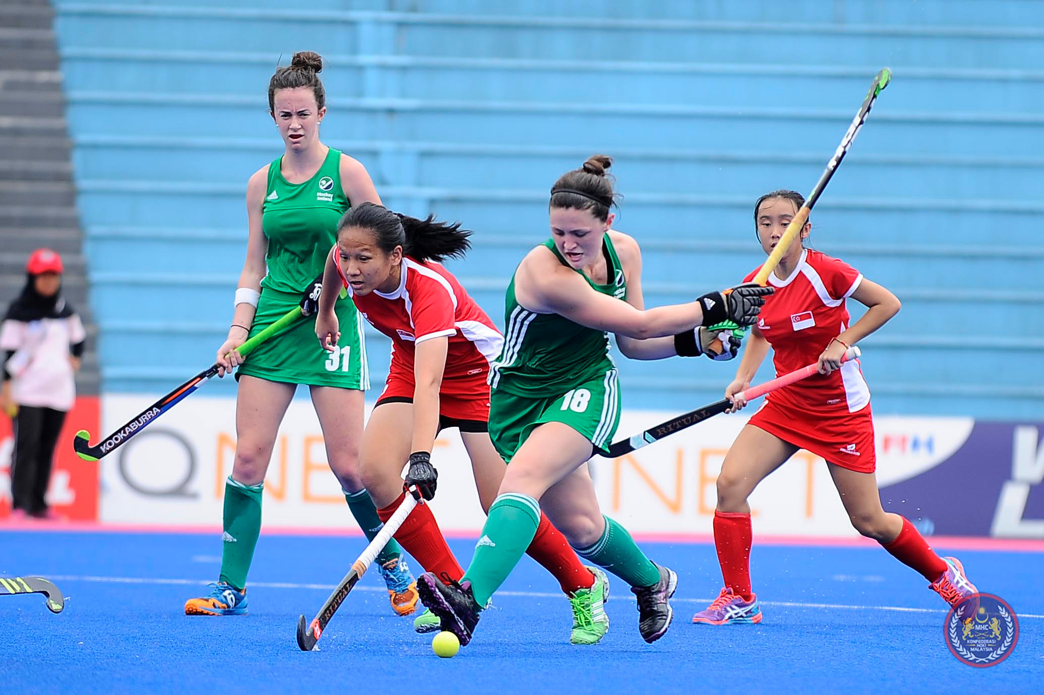 Former UConn standout Roisin Upton '16 (ED) swings at the ball during a game against Hong Kong in South Africa in January. Since graduating, Upton traded her UConn blue jersey for the green of the Irish National Team.