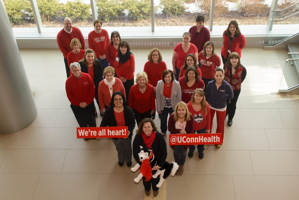 Staff gathered in the lobby of UConn John Dempsey Hospital's new tower to show how they Go Red for Women's heart disease awareness and prevention (Photo: UConn Health/Janine Gelineau).