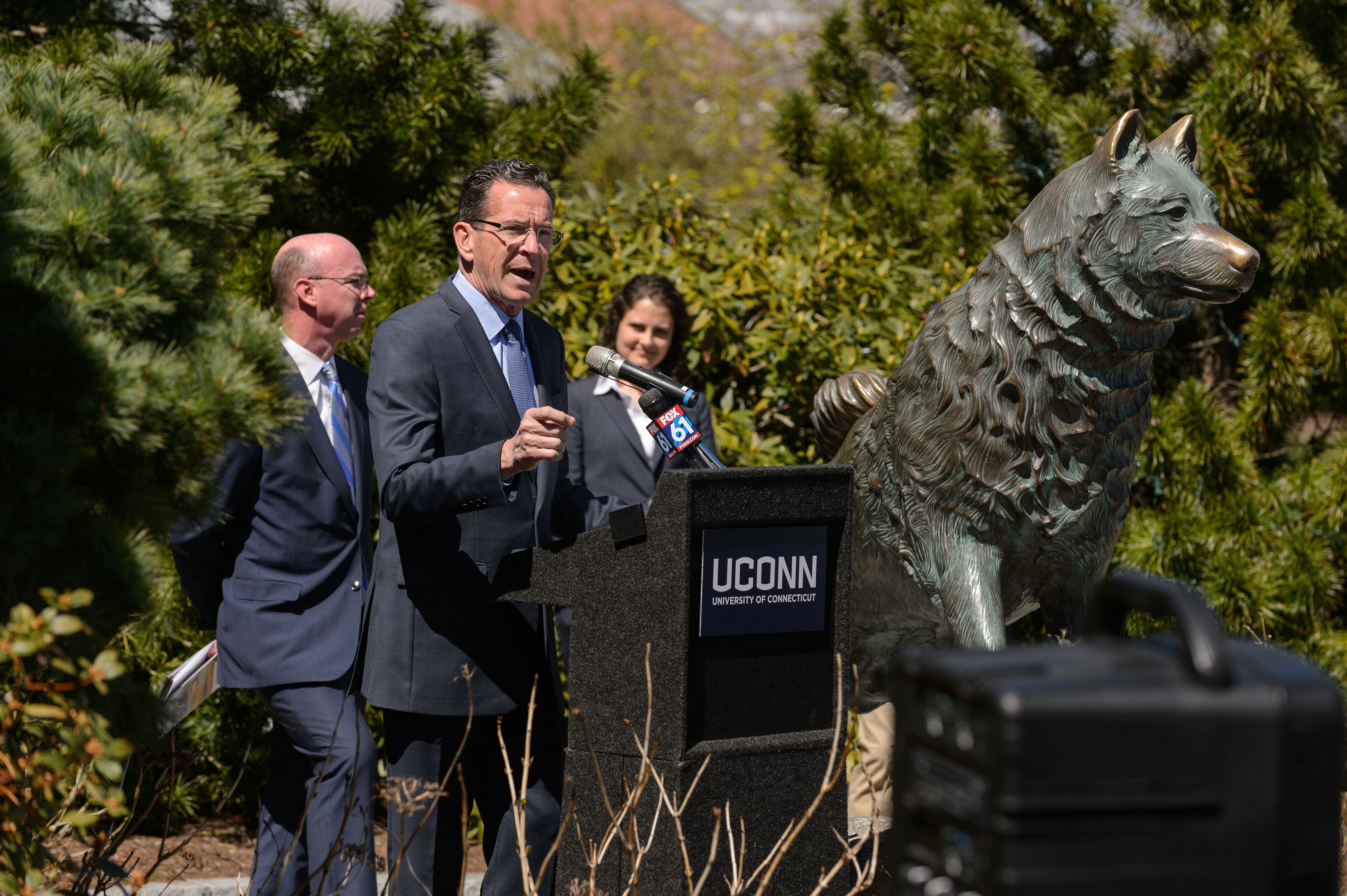Gov. Dannel Malloy, center, speaks at a media event at the Wolff Family Park to recognize energy saving initiatives with Eversource on April 18, 2017. At left is Jim Hunt, senior vice-president for regulatory affairs at Eversource and Mary Sotos, deputy commissioner of DEEP. (Peter Morenus/UConn Photo)