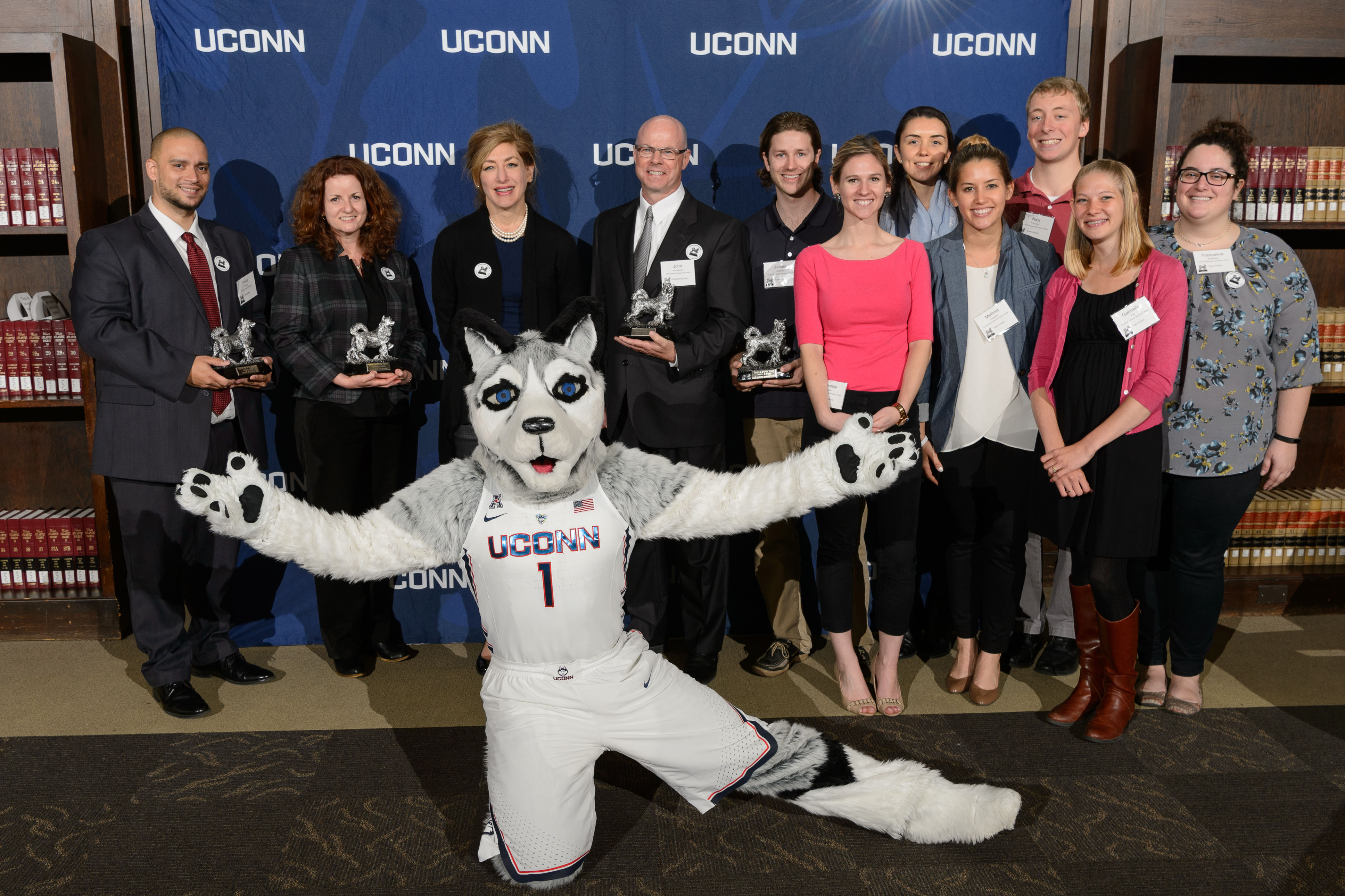 President Susan Herbst and Jonathan the Husky pose with UConn Spirit Awards recipients at the Wilbur Cross South Reading Room on April 25, 2017. (Peter Morenus/UConn Photo