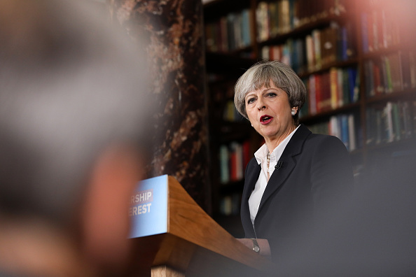 Theresa May, U.K. prime minister and leader of the Conservative Party, delivers a speech at the Royal United Services Institute (RUSI) in London, U.K., on Monday, June 5, 2017. U.K. opposition Labour leader Jeremy Corbyn traded blows with May over who has the worst record on countering terrorism, as Britains battle with jihadists looked set to dominate the final three days of the election campaign. Photographer: Chris Ratcliffe/Bloomberg via Getty Images