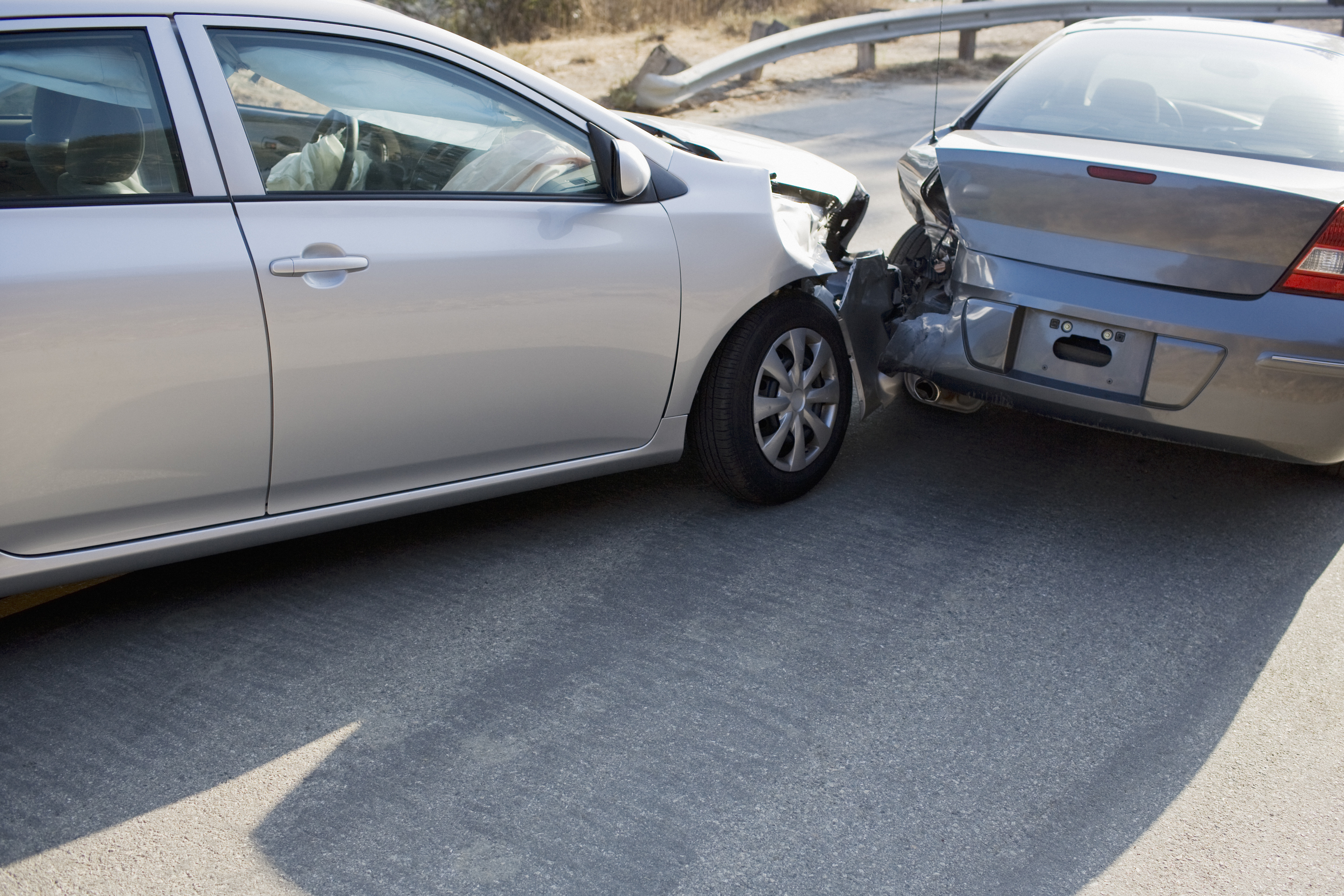 Two cars in collision on a roadway. (Getty Images)
